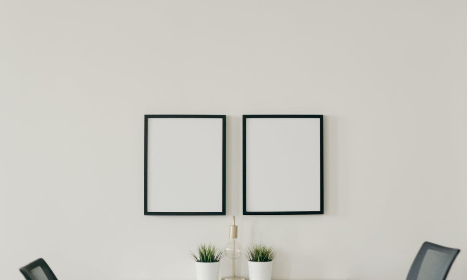 white wooden table with chairs in a room