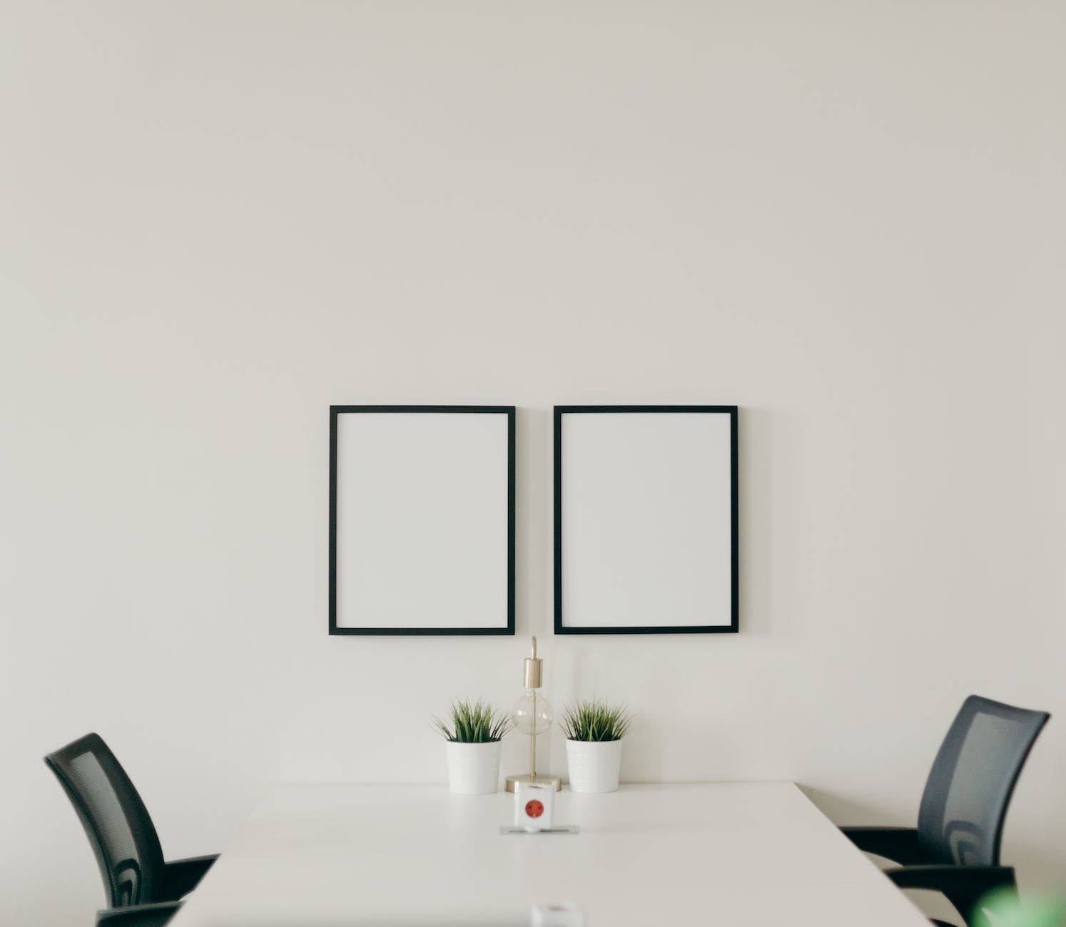 white wooden table with chairs in a room