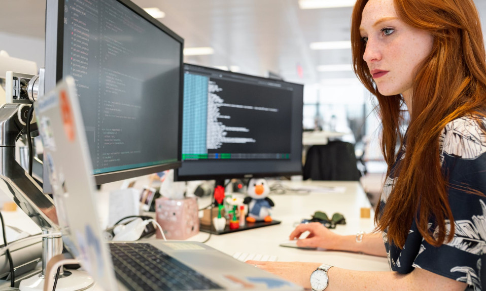 woman coding on computer