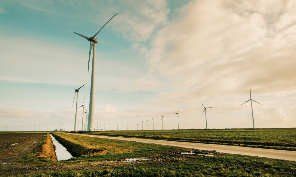 windmill energy on green grass field