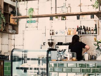 woman wearing black shirt in a coffee shop