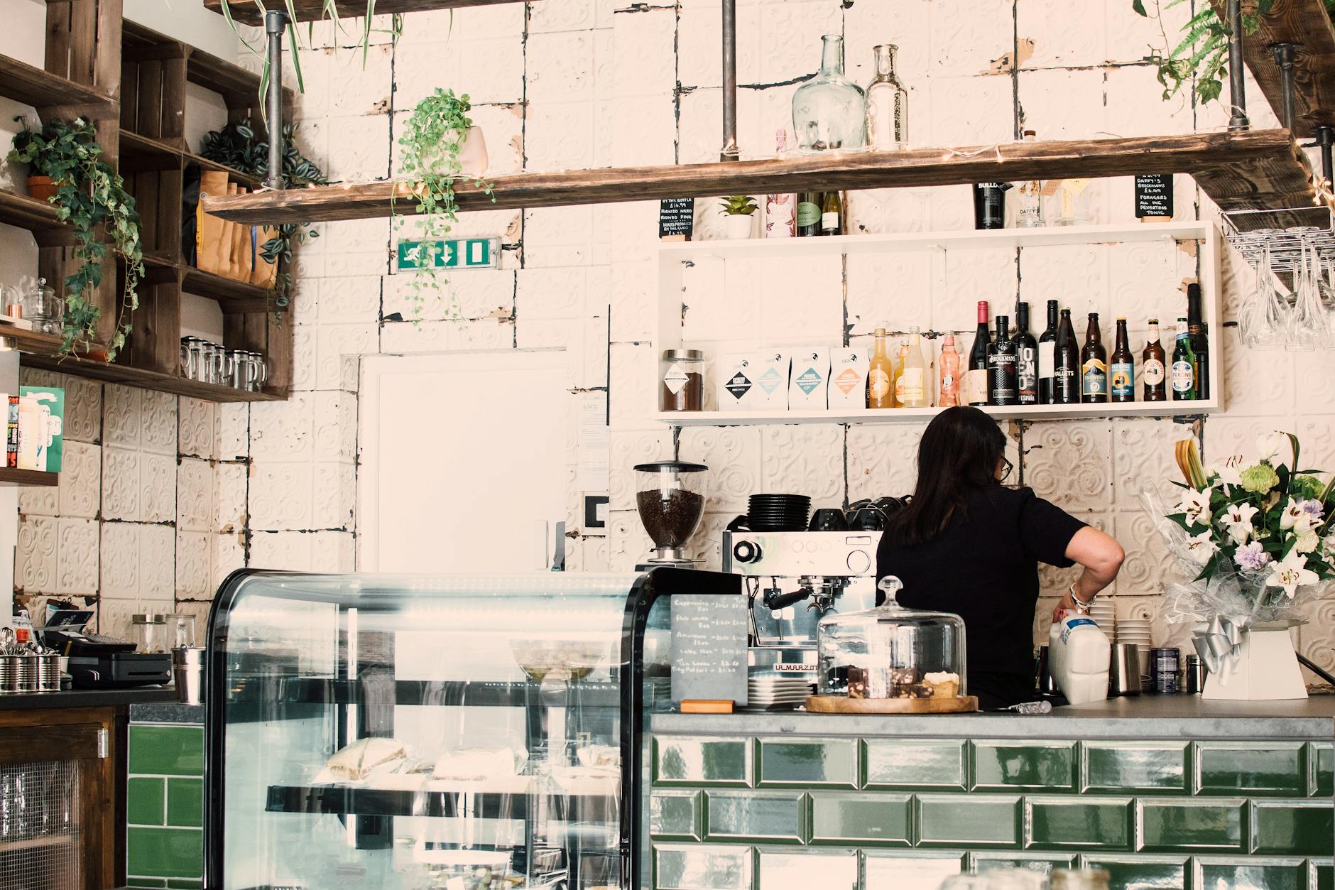 woman wearing black shirt in a coffee shop